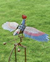 The Large Metal Rooster Rocking Garden Spike Displaying the Coloured Wings from Behind