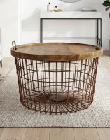 The Large Rustic Iron Table Basket placed on a Cream Rub in a Modern Living Room Interior - Digital Illustration