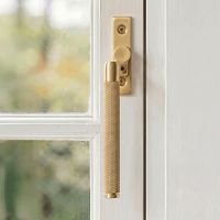 The Right Handed 16mm Satin Brass "Royale" Espagnolette Window Handle Fixed on a Handpainted White Window Frame - Digital Illustration 