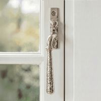 The Left Handed Polished Nickel Hammered Espag Window Handle Fixed on a Painted White Window Frame - Digital Illustration The Left Handed Polished Nickel Hammered Espag Window Handle Fixed on a Painted White Window Frame - Digital Illustration