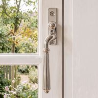 The Left Handed Polished Nickel Reeded Georgian Espagnolette Window Handle on a White Wooden Window Frame in a Country Home- Digital Illustration The Left Handed Polished Nickel Reeded Georgian Espagnolette Window Handle on a White Wooden Window Frame in a Country Home- Digital Illustration