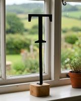 The Letter "T" Monograph Metal & Wood Letter Display Ornament on a White Window Sill in a Country Cottage - Digital Illustration 