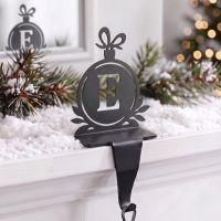 The Letter E Stocking Holder on a Snow Covered Mantelpiece - Digital Illustration The Letter E Stocking Holder on a Snow Covered Mantelpiece - Digital Illustration