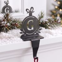 The Letter G Stocking Holder on a Mantelpiece in a Home decorated with Christmas Decor - Digital Illustration The Letter G Stocking Holder on a Mantelpiece in a Home decorated with Christmas Decor - Digital Illustration