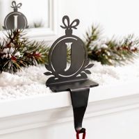 The Letter J Stocking Holder in a Modern Interior Decorated for Christmas - Digital Illustration The Letter J Stocking Holder in a Modern Interior Decorated for Christmas - Digital Illustration