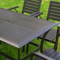The Linea 6-Seater Outdoor Garden Dining Set in Black Showing a Close up of the Alternate Patterned Wood Effect Table Top