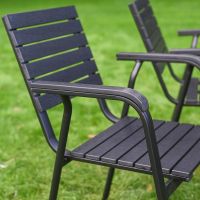 The Linea 6-Seater Outdoor Garden Dining Set in Black Showing the Curved Armrest