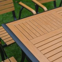 The Linea 6-Seater Outdoor Garden Dining Set in Teak Showing a Close up of the Alternate Patterned Wood Effect Table Top
