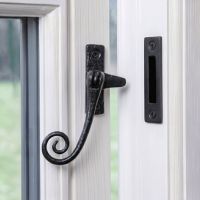 The Lockable Monkeytail Window Casement Fastener Fitted on a Classic White Window Frame in a Country Home - Digital Illustration