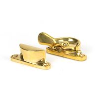 The Locking Fitch Sash Window Fastener - Polished Brass on a White Background The Locking Fitch Sash Window Fastener - Polished Brass on a White Background