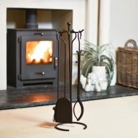 "The Lunatum" Four Piece Companion Set In A Fireplace Setting