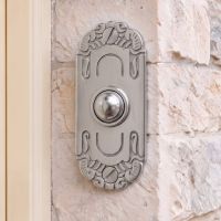 The "Mackintosh" Satin Chrome Ornate Bell Push on a White Stone Wall on a Cottage Entrance - Digital Illustration The "Mackintosh" Satin Chrome Ornate Bell Push on a White Stone Wall on a Cottage Entrance - Digital Illustration