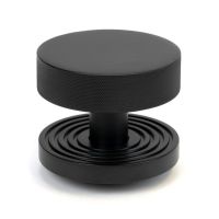 The Matt Black Knurled Centre Door Knob on a Beehive Rose Shown Upright on a White Background The Matt Black Knurled Centre Door Knob on a Beehive Rose Shown Upright on a White Background