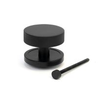 The Matt Black Knurled Centre Door Knob on a Plain Rose with Bolt Fitting on a White Background The Matt Black Knurled Centre Door Knob on a Plain Rose with Bolt Fitting on a White Background