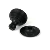 The Matt Black Traditional Beehive Centre Door Knob on a White Background Shown From Behind with Rose The Matt Black Traditional Beehive Centre Door Knob on a White Background Shown From Behind with Rose