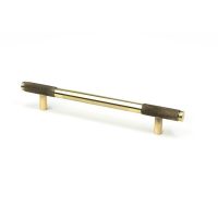 The Medium Half Knurled Cabinet Pull Handle in Aged Brass Shown Upright on a White Background The Medium Half Knurled Cabinet Pull Handle in Aged Brass Shown Upright on a White Background
