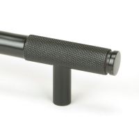 The Medium Half Knurled Cabinet Pull Handle in Aged Bronze Looking Close up of the End of the Knurled Handle The Medium Half Knurled Cabinet Pull Handle in Aged Bronze Looking Close up of the End of the Knurled Handle