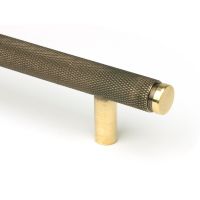 The Medium Knurled Cabinet Pull Handle in Aged Brass Showing a Close up of the Edge of the Handle The Medium Knurled Cabinet Pull Handle in Aged Brass Showing a Close up of the Edge of the Handle