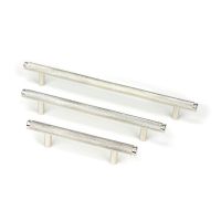 The Medium Knurled Cabinet Pull Handle in Polished Nickel Shown Alongside Other Sizes on a White Background The Medium Knurled Cabinet Pull Handle in Polished Nickel Shown Alongside Other Sizes on a White Background