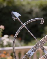 The Medium Size Profatious Bright Chrom Armillary on a Stone Garden Wall Close up View of the Arrowhead - Digital Illustration 