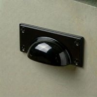 The Midnight Black Rectangular Drawer Pull with Curved Handle Fitted on a Green Kitchen Cupboard Drawer - Digital Illustration The Midnight Black Rectangular Drawer Pull with Curved Handle Fitted on a Green Kitchen Cupboard Drawer - Digital Illustration