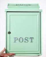 The Mint Green "Oxford" Wall Mounted Post Box with Silver Detail with Hnad in Shot for Scale The Mint Green "Oxford" Wall Mounted Post Box with Silver Detail with Hnad in Shot for Scale