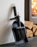 The Modern Black and Chrome Brush and Pan Set next to a Cream Coloured Fireplace with a Log Burner Stove - Digital Illustration 