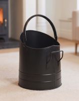 The Modern Black Coal Bucket Placed on a Carpet in Front of a Lob Burner Stove - Digital Illustration The Modern Black Coal Bucket Placed on a Carpet in Front of a Lob Burner Stove - Digital Illustration