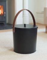 The Modern Black With Leather Handle Ash Bucket Displayed with an Upright Brown Handle in Front of a Decorative Fireplace - Digital Illustration The Modern Black With Leather Handle Ash Bucket Displayed with an Upright Brown Handle in Front of a Decorative Fireplace - Digital Illustration
