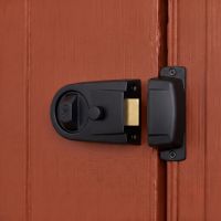 The Modern Rim Nightlatch with Cylinder Lock in a Matte black and Brass Finish Fitted on a Contemporary Wooden Door - Digital Illustration 