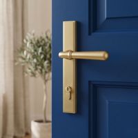 The Modern Satin Brass Slim Espagnolette Door Handle & Lock Set on a Blue Door in a Contemporary Home - Digital Illustration