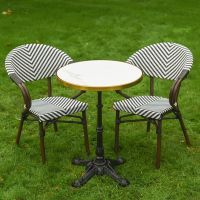 The Monaco Parisian Bistro Set in Black and White Shown at a High Angle on a Green Garden lawn