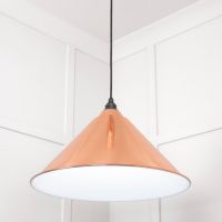 The Nidus Pendant Light in Copper and Glossy White Shown from a Low Angle