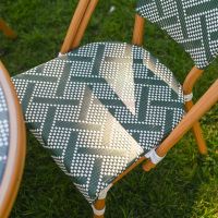 The Orbis Diamond 4-Seater Bistro Dining Set in Green & White Showing the Patterned Seat of the Chairs