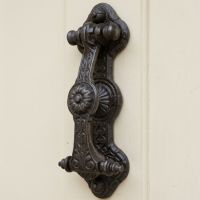 The Ornate Regency Door Knocker on a Classic Cream Timber Front Door - Digital Illustration