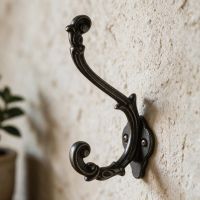 The Ornate Scroll coat hook in Natural Iron Fitted onto a Textured Magnolia Coloured Wall - Digital Illustration The Ornate Scroll coat hook in Natural Iron Fitted onto a Textured Magnolia Coloured Wall - Digital Illustration
