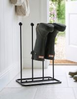 The Oxford Lacquered Steel Two Pair Boot Rack Placed on a Cream Tile Floor - Digital Illustration 