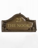 The Painter and Decorators House Name Sign with Custom Vinyl Writing on a White Background The Painter and Decorators House Name Sign with Custom Vinyl Writing on a White Background