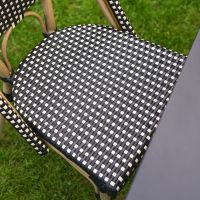 The Parisienne Bistro 2 Seater Outdoor Dining Set in Black and White Showing a Close up of the Rattan Weave Seat