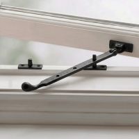 The Pear Drop End Cast Iron Window Stay Fixed on a White Wooden Window Frame - Digital Illustration 