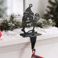 The Penguin with Candy Cane Stocking Holder on a Decorated Mantelpiece in a Modern Home - Digital Illustration
