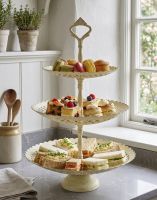The “Perincroft House” Cream Three Tiered Cake Stand next to a Kitchen Window Displaying Cakes and Sandwiches for an Afternoon Tea - Digital Illustration The “Perincroft House” Cream Three Tiered Cake Stand next to a Kitchen Window Displaying Cakes and Sandwiches for an Afternoon Tea - Digital Illustration