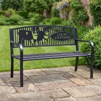 The Personalised Border Collie Pair Iron & Steel Park Bench in Black with Custom Text of Cottage Name on a Patio in a Traditional Garden - Digital Illustration The Personalised Border Collie Pair Iron & Steel Park Bench in Black with Custom Text of Cottage Name on a Patio in a Traditional Garden - Digital Illustration