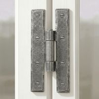 The Pewter 3¼" Inch H Hinge Pair Shown Attached to a Vintage White Window Frame in a Country Home - Digital Illustration 