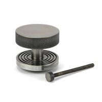 The Pewter Knurled Centre Door Knob on a Beehive Rose with Bolt Fitting on a White Background 