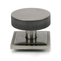 The Pewter Knurled Centre Door Knob on a Square Rose Shown Upright on a White Background The Pewter Knurled Centre Door Knob on a Square Rose Shown Upright on a White Background