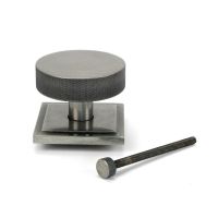 The Pewter Knurled Centre Door Knob on a Square Rose with Bolt Fitting on a White Background The Pewter Knurled Centre Door Knob on a Square Rose with Bolt Fitting on a White Background