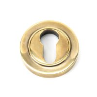 The Plain Concealed Standard Euro Escutcheon - Aged Brass on a White Background The Plain Concealed Standard Euro Escutcheon - Aged Brass on a White Background