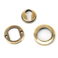 The Plain Concealed Standard Euro Escutcheon - Aged Brass with all of the Components The Plain Concealed Standard Euro Escutcheon - Aged Brass with all of the Components