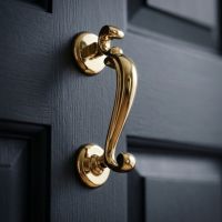 The Polished Brass "Watson" Brass Doctor"s Door Knocker on a Navy Blue Wooden Door - Digital Illustration The Polished Brass "Watson" Brass Doctor"s Door Knocker on a Navy Blue Wooden Door - Digital Illustration